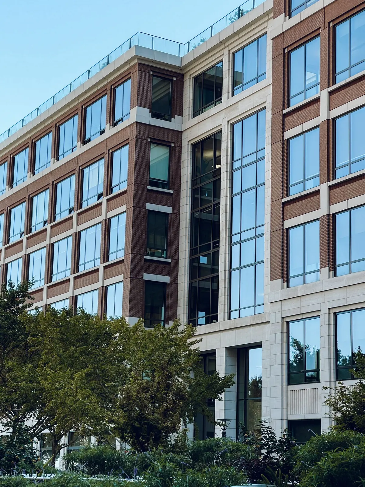 Modern commercial office building with a brick and glass facade